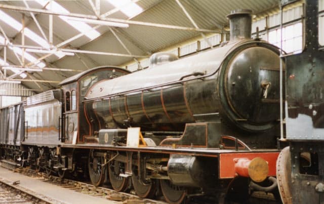 63395 on display with an information board on her running plate awaits overhaul work at NELPG's shed near Deviation Shed, Grosmont, 1994 (R Pearson)