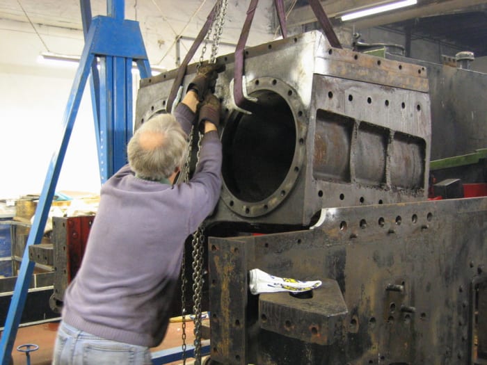 A fracture in the cylinder block was the main reason for work needed, with other jobs arising. Here the cylinder block is lifted from the frames