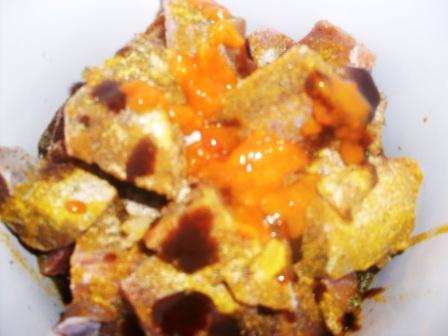 goat meat in slow cooker with curry powder, hot pepper sauce, jerk sauce and other spices. Stir well, adding 1/4 cup water