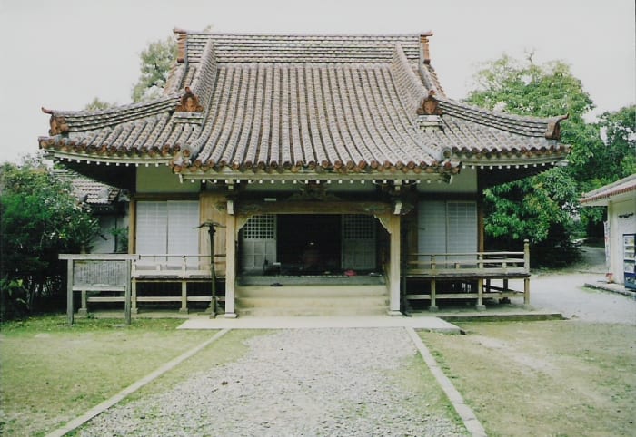 The Kin Kannon Buddhist temple in Kin, Okinawa. In the caves below the temple is an aomori distillery.