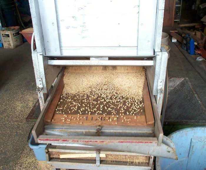 If the adjustment is too wide, some grain is shaken off the end of the first screen into a discard bucket or barrel. If it is too narrow, time is wasted.