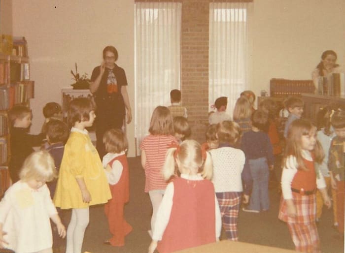 Here I am back in the 1970s when I first held weekly storytimes. We're all having a turn around before we sit back down. Young children can't sit for long stretches of time.