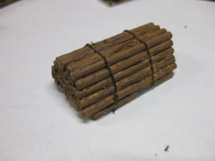Real wood,(cocktail sticks) painted dark to look like hardwood, 2mm chain again - for either timber or steel-built wagons