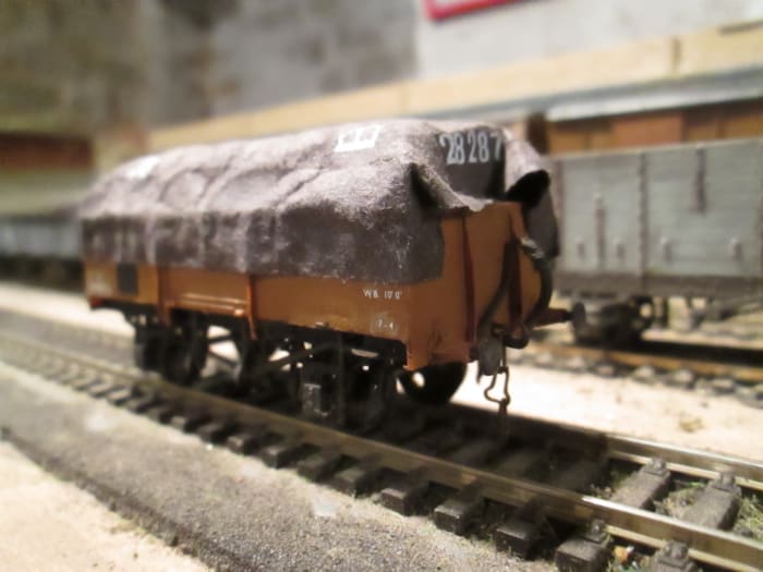 'Tarpaulined' Steel-bodied 13 ton ex-LNER open (Parkside kit - I have several different types with tarpaulins fixed permanently over plastic formes) Block of plastic under the tarpaulin is enough for the illusion to work.