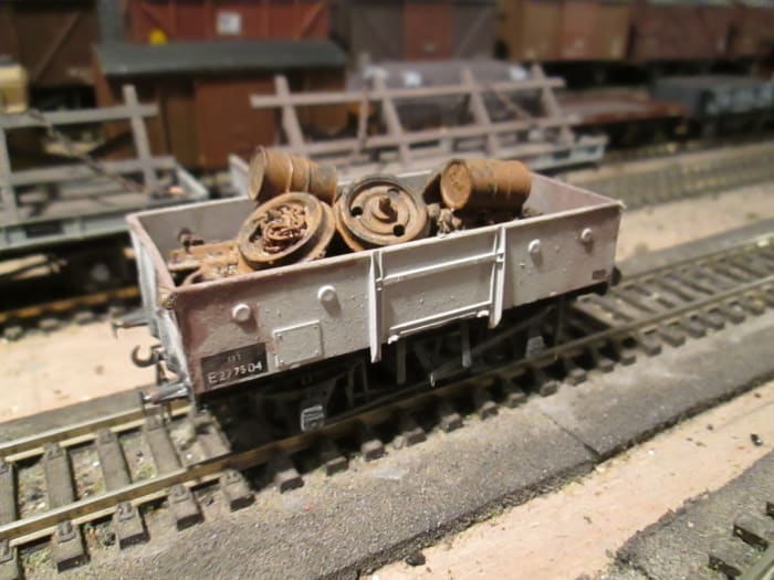 The unfitted version with railway scrap load - the LNER built many of these wagons without vacuum brake cylinders and clasp brakes, putting Morton type on instead. Parkside kit modified with Morton Brake detailing. Weathered plastic load