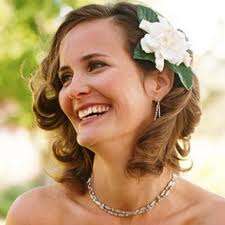 One of my favorites is to pull back just one side and accessorize with a statement piece like a flower or a fancy barette.