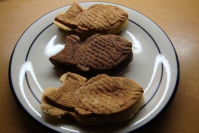Taiyaki. The middle one is filled with dark chocolate and was thus made with a darker dough to differentiate it from the others.