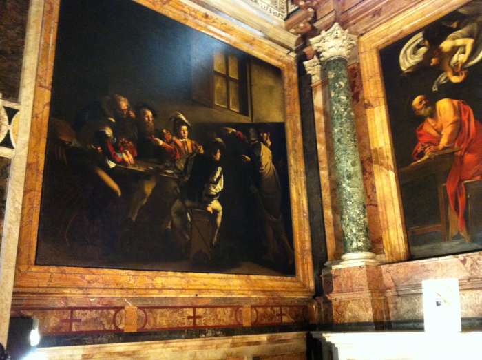 San Luigi dei Francesi church. The painting on the left is Caravaggio's "The Calling of St Matthew" and a portion of his "St Matthew and the Angel" is on the right.