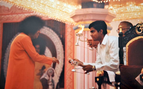 Swami used to 'light' the camphor for quite some time after which He expected the devotee to do the 'lighting' on his own!