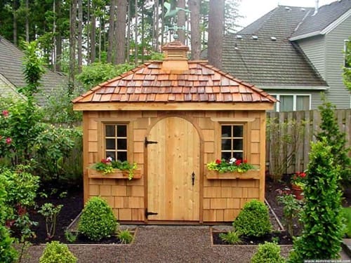 beautiful wood garden shed with window boxes, natural wood cedar siding and roof and cupola