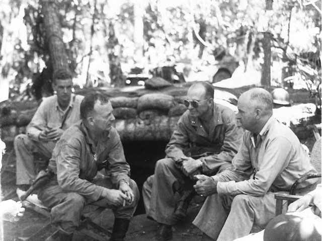 1942-Gen. Patch (center w/shades) on Guadalcanal, seated next to Marine General Vandegrift (right) while being briefed by Marine Col. Hall Jeschke.