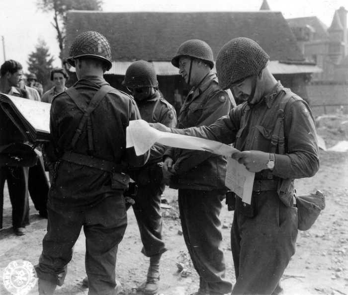 No ivory-handled pistols or necktie - Eddy meeting with his staff in Normandy.