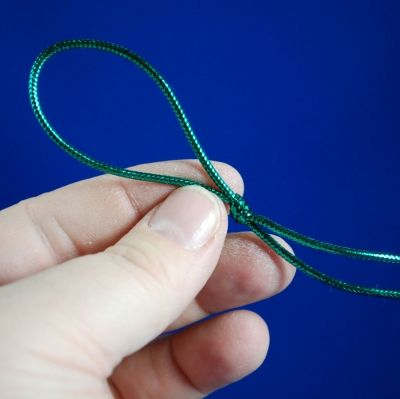 Make a simple loop about 2-3 inches long. Leave a couple of inches of loose ends, so there's no danger of the knot coming undon