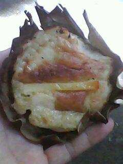 Bibingka, rice cake with slivered salted or freshly boiled eggs and ,usually prepared in a charcoal oven