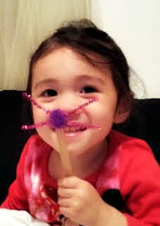 Use a popsicle stick, pipe cleaners and a pom pom to make this easy bunny face. Don't forget to add the bunny ears headband!