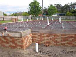 This is a low set brick base, before laying the concrete slab, in this case this low-set house could be a brick veneer, if the internal walls are made with timber, or it can be a cavity brick house if the interior is built with bricks.