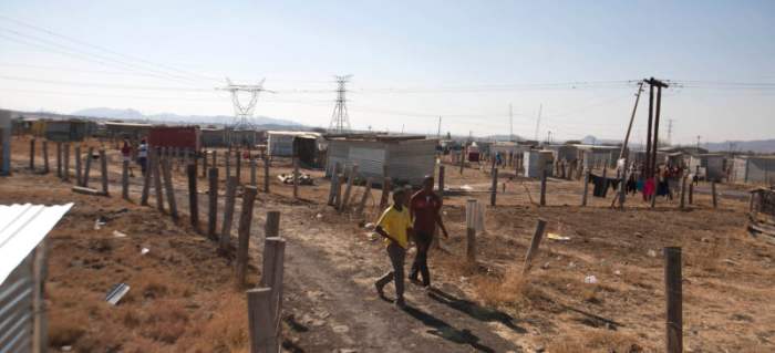 Ramshackle Hovel Where Miniers Live-Cyril Ramaphosa is one of he Shareholders on some mine some of these miners on strike in.