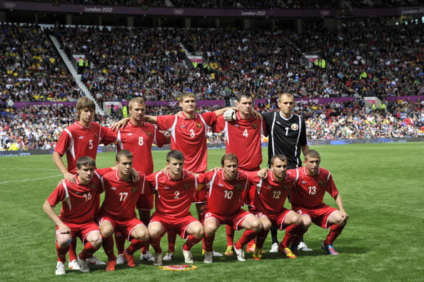 Belarus's starting lineup poses ahead of its match against Brazil at Old Trafford in Manchester, England.