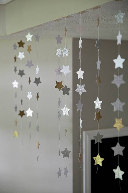 Hanging star decorations - string, star paper cutouts and some tape are all that's needed to make these eye catching decorations.