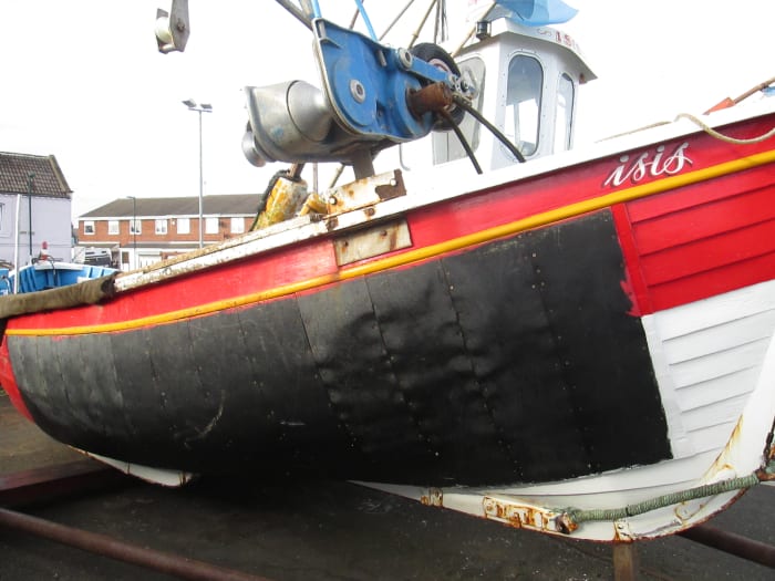 A much patched up Coble with cab and net winch on Fisherman's Square, Redcar (off Lord Street, behind High Street East)