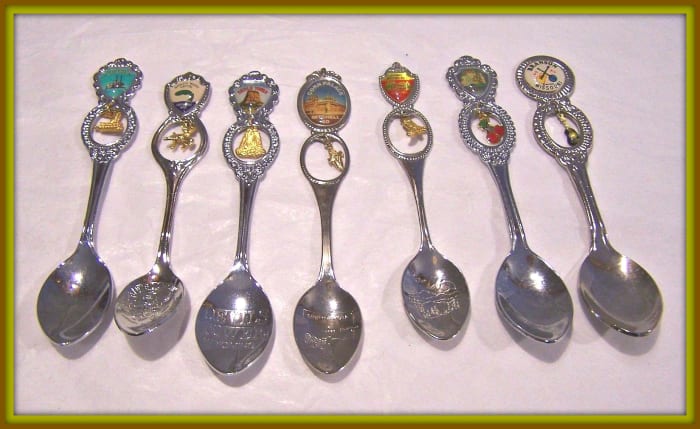 Here is an nice set of Vintage Collector Spoons with seven different Spoons with Souvenir Charms with Handle engraved. Door County, Branson Missouri, Cosmos Mystery Area, Corn Place, Devilâs Tower Wyoming, Worldâs Musky Capital, & the Arabia