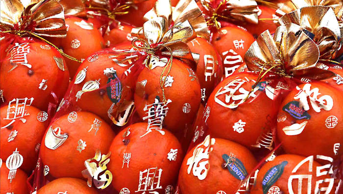 Presentation - Oranges are not the only fruit in Bangkok's Chinatown - to make them stand out that little bit more, they are wrapped in attractive cellophane