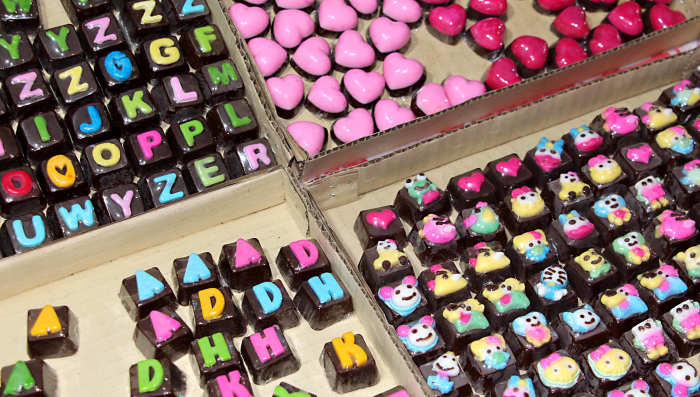 Chocolates anyone? Not a wrapper in sight - just multicoloured letters, hearts and other symbols. (See also the image at the end of the page - my signature in chocolates, as arranged for the photograph by my girlfriend)