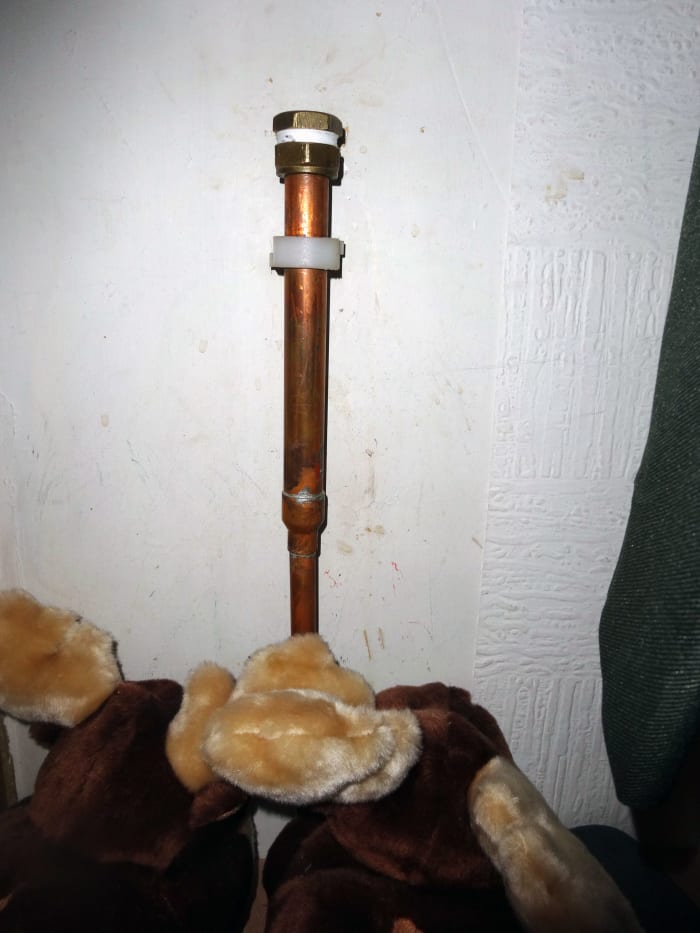 The access pipe the plumber installed in the bedroom wardrobe for adding cleaning and protective fluids to the radiators