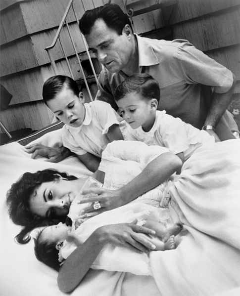1957, Elizabeth Taylor with newborn Liza Todd and her sons Christopher and Michael H. Wilding, and her husband Michael Todd