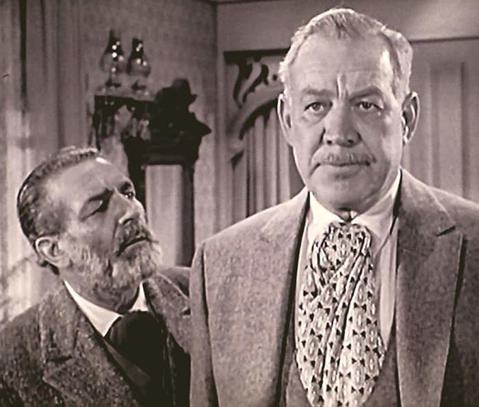 Frank McGrath (left) and Ward Bond. Notice the contrast in their faces. McGrath was "Charlie Wooster" and Bond was "Major Seth Adams" on Wagon Train.