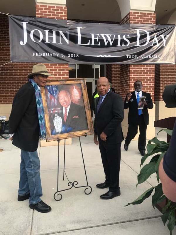 Dr. Ron presents Congressman and Civil Rights Leader, John Lewis, with a portrait for "John Lewis Day" in Troy, Alabama