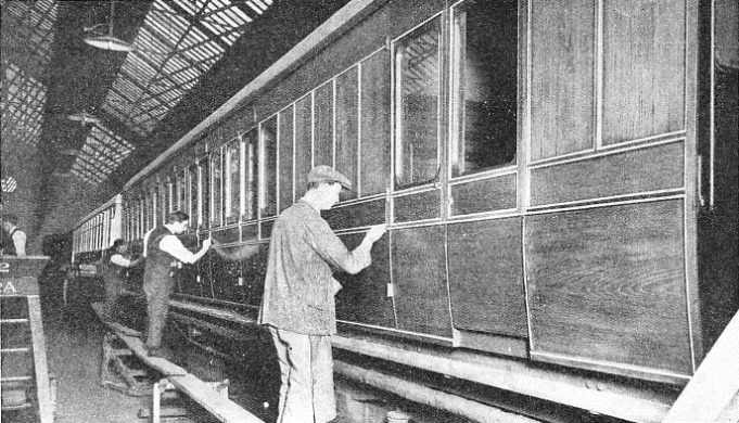 At York carriage works, where once David Bain's NER carriages were assembled, employees finish the varnishing stage on one of the teak pannelled Gresley non-corridor commuter carriages. Carriage building was undertaken at various LNER sites