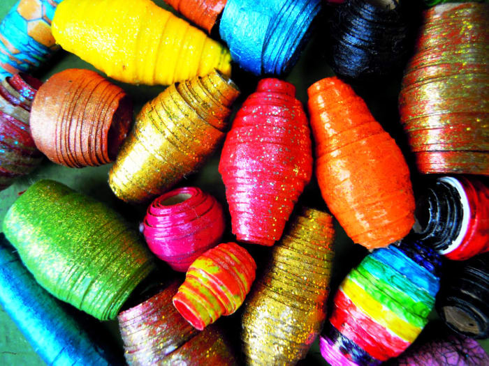 Paper beads are the perfect use for all your paper scraps. Even the tiniest scrap can be used to make a small bead