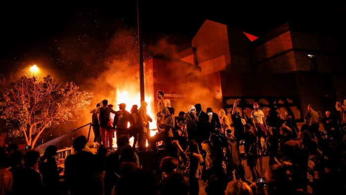 Rioters setting fire on a Minneapolis police station in late May, 2020 after the George Floyd incident