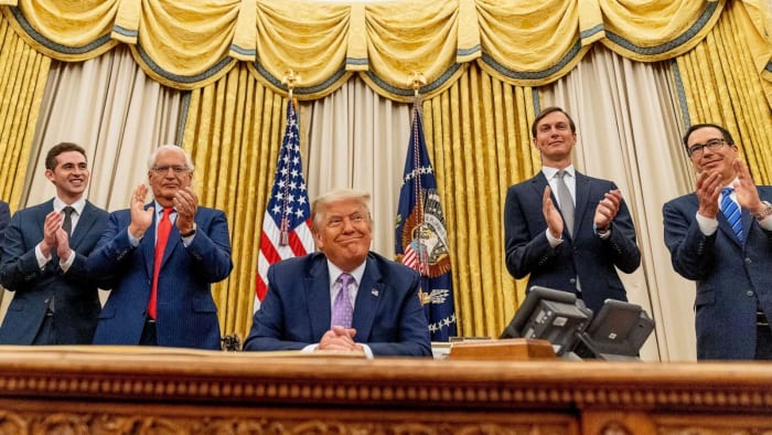 President Trump and his aides in the Oval Office on August 14, 2020 after the US successfully brokered a historic peace deal between Israel and the UAE