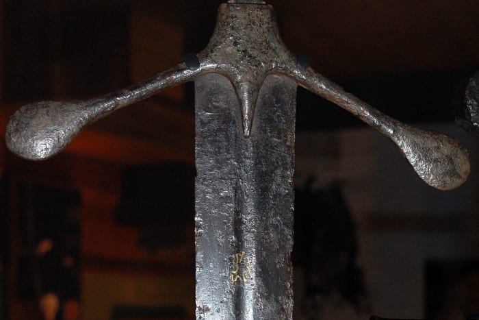 A sword's quillion prevents enemy blades from sliding toward any fingers that might be wrapped around its handle.