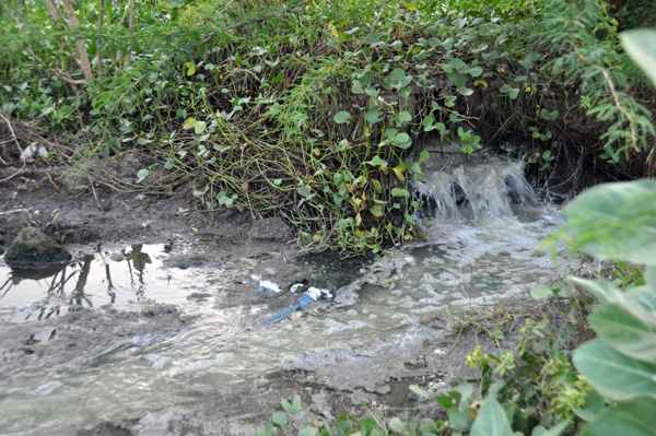 Just below the Durga temple is an opening. This constantly dumps the drain waters into the Chitravati.