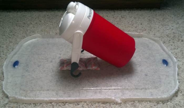 Make sure you do NOT seal the container shut if you have dry ice in it. We also tried using hand warmers, pictured under the cooler, to attract with heat, but we saw no difference in effect. Apparently it is the CO2 that draws the bugs.