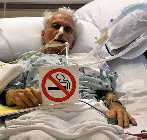 This was the caption that went with this picture: Last Request; Please Don't Smoke My father asked me to take this picture of him after he regained consciousness in CCU. He lost the fight with lung disease. (Asbestosis, COPD, and Pnuemonia)