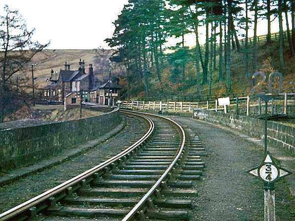 A Brian Johnson photograph of Lambley Station at the south-eastern end of the viaduct. The post (right) is an NER 3/4 mile measurement from the last half-mile post, a quarter mile post before that and so on. Measurements made from a branch datum post