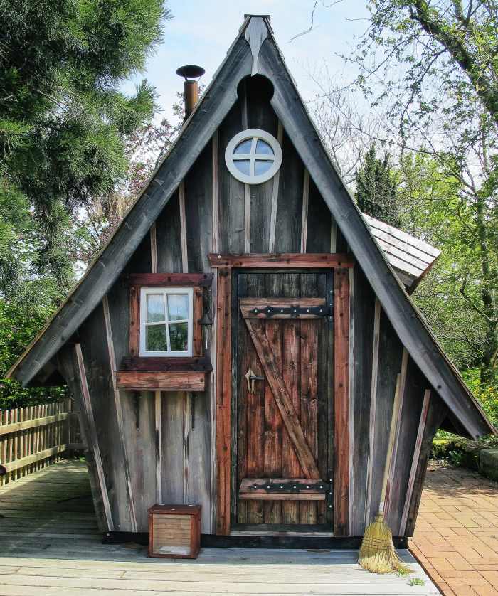 A witch's house for a children's playhouse. Building this wooden shed would be a fun and challenging project for a wood craftsman.