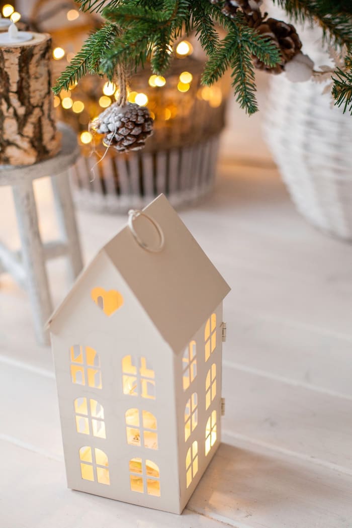You could paint this little house or keep it plain white for an artsy look. Put a battery powered candle inside to light it up.