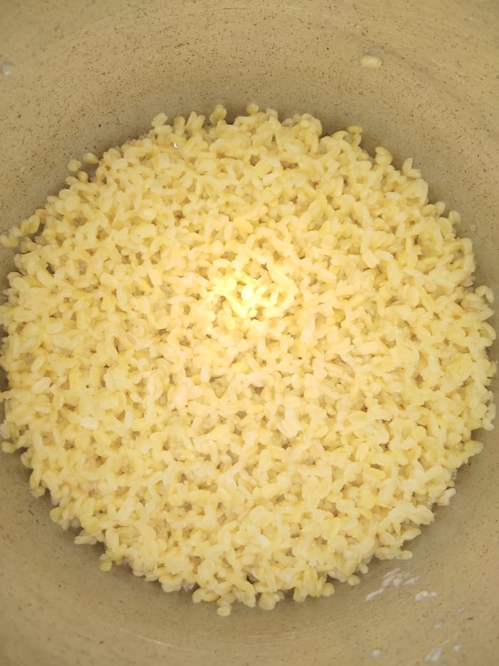Let the pressure release by itself. Once the pressure settles down open the lid of pressure cooker and check if lentil is cooked properly. With the help of spoon or ladle mash the dal properly.