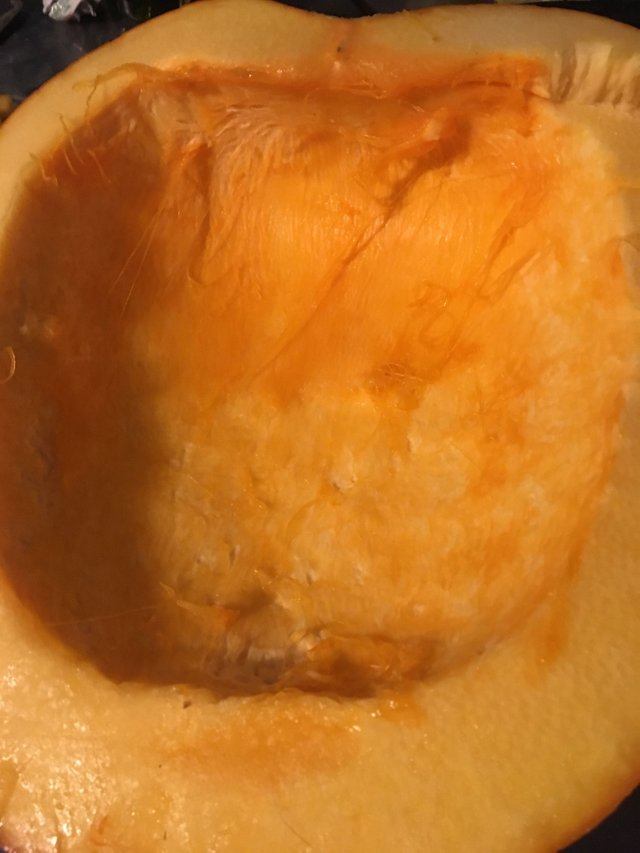 I use a big metal spoon to clean mine out. The insides are slippery so some sort of tool helps with scraping it all out.
