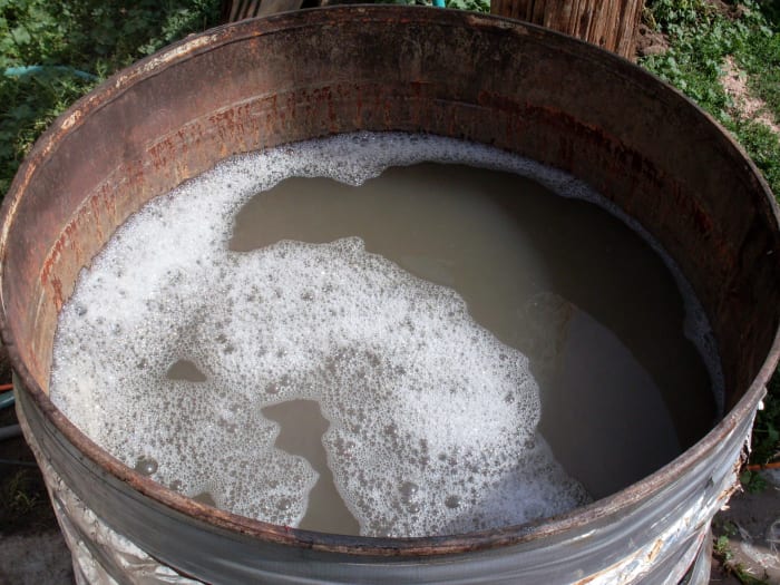 A bit of dish detergent makes the water penetrate better, and so helps the scalding and plucking. Have a thermometer clipped to the side of the scalder.