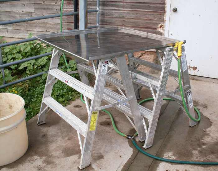 Our work table, a stainless steel sheet with "lips" on 3 sides. We also had 2 garden hoses with spray nozzles.