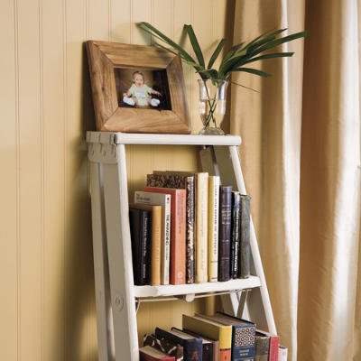 An old stepladder (you may have one lying around in your garage or basement) can be easily converted into a great little bookcase!