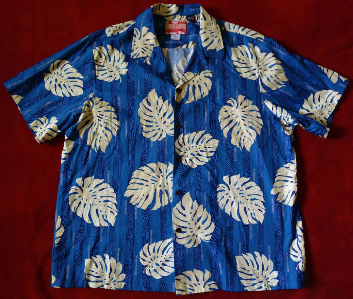 Mens Hawaiian Aloha Shirt from RJC - Made in Hawaii of 100% Cotton. With a beautiful sea blue color print with Tropical Palm leaves.