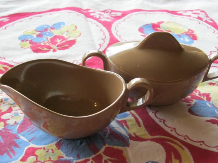 Unmarked later Melamine sugar and creamer. Modern style in medium tan, lighter weight than earlier pieces.