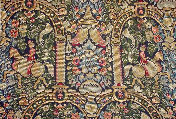 A reproduction of a medieval design woven into upholstery fabric on a Jacquard Loom. Copyright 2014 Restoration Fabrics & Trims. All Rights Reserved. Used with Permission.